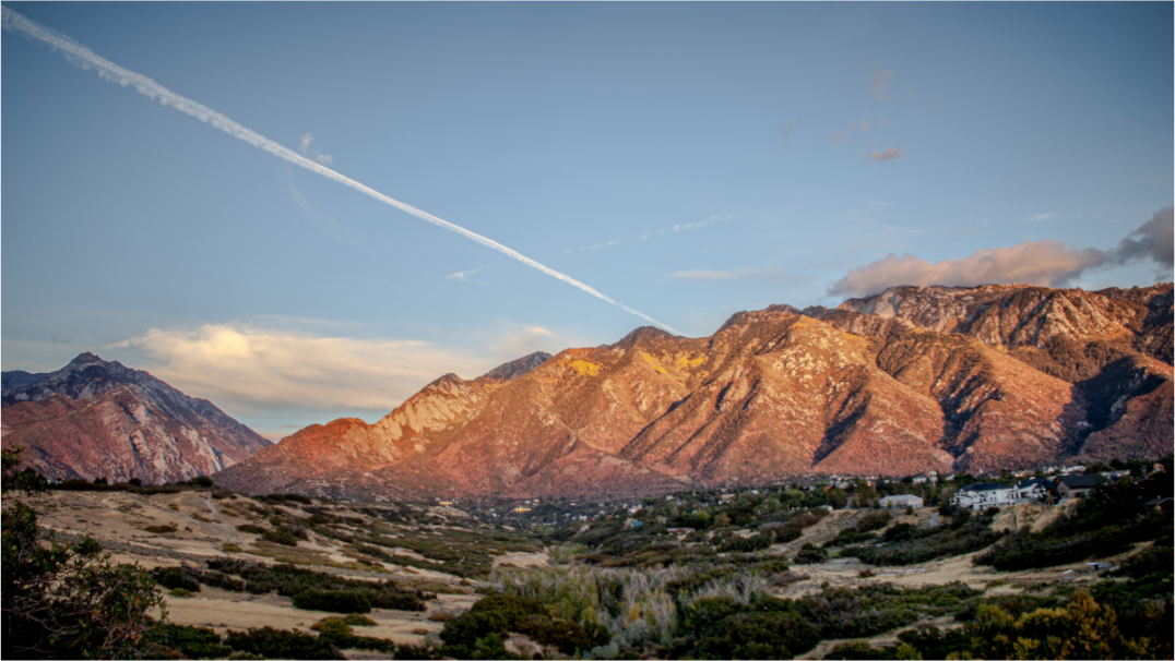Main image Alpenglow on Wasatch Mountains with Jet Contrail