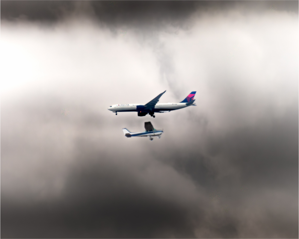 Main image Delta Jet and Cessna Propeller Plane Stormy Sky West Jordan