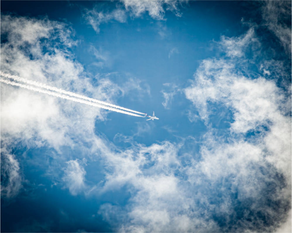 Main image High-Altitude Jet with Contrails and Wispy Clouds SLC